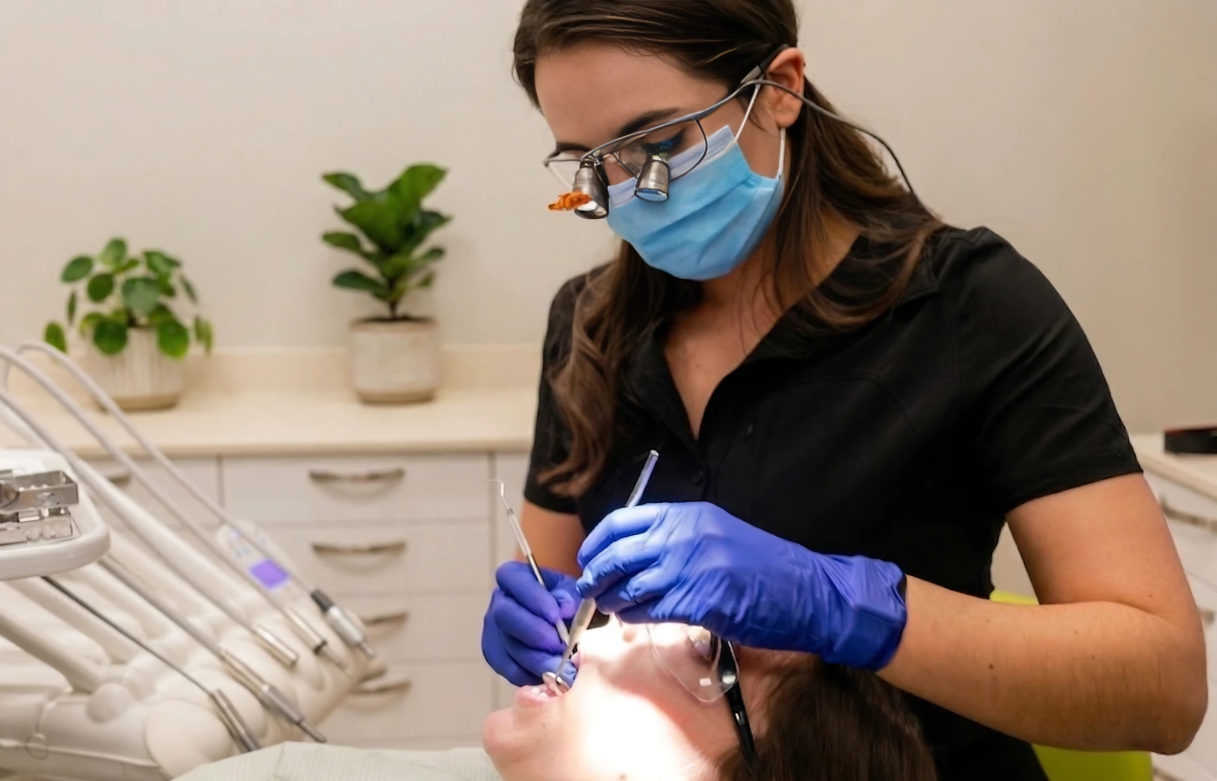 Dr. Cheyanne Olsen providing treatment at Crestmont Dental
